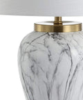 Close-up of 28-Inch White And Gold Ceramic Marble LED Table Lamp With Hand-Painted Faux Marble Base And White Linen Drum Shade