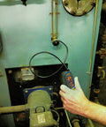 Hand using PalmScope Compact Borescope Video Inspection Camera Grey, Pocket-Sized Handheld for machine inspection