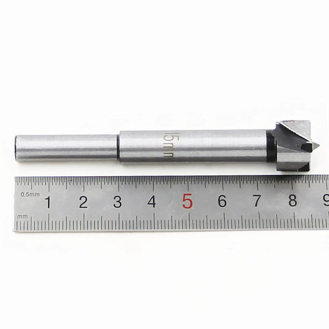 Heavy Duty Forstner Bit Set With Carbide Tips And High Speed Steel Shank 15mm with metric ruler for precise measurements.