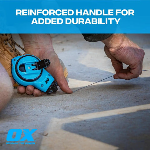 Hands using Trade Ready Workhorse Heavy Duty Chalk Reel With 100 Ft Thin Line Small Chalk Line, blue color, on concrete surface.