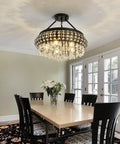 5 Light Black Crystal Round Chandelier Chic Modern Semi Flush Mount Ceiling Light Fixture in a dining room setting