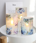 Blue Violet Hydrangea Flameless Candles Set With LED Flicker And Remote Dim, lit on white table, perfect for wedding decor