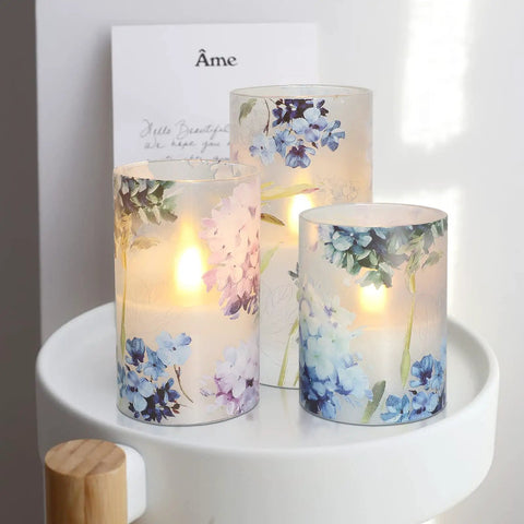 Blue Violet Hydrangea Flameless Candles Set With LED Flicker And Remote Dim, lit on white table, perfect for wedding decor
