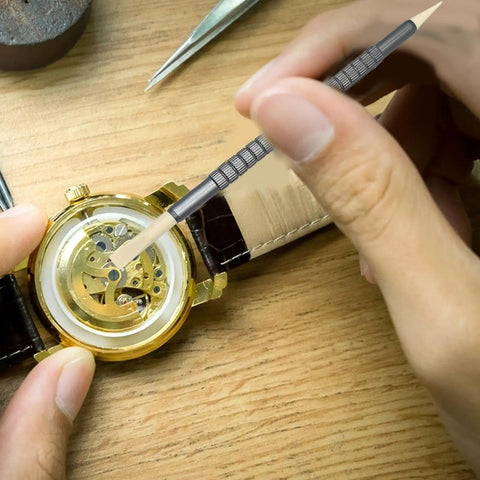 Precision Watch Cleaning Pen With Double Head Rubber Tips For Dials, Case Gaps, And Gear Clearance in use on watch gears
