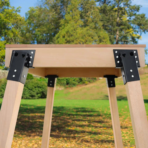 Built Tough Four By Four Steel Bracket Kit With Rugged Black Powder Coating For Hunting Box Blinds Tree Platforms And Backyard Decks Heavy Duty Corner Mounts 4 Piece Pack with installed brackets supporting wood platform.
