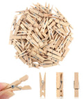 Top Shelf 100 Piece Mini Wooden Clothespins With Handy Storage Bag Dead Serious Grip Birch Hardwood Clips displayed in a pile with close-up grips.