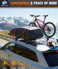 4 Pack Auto Retracting Ratchet Straps 1x10 Ft Self Roll Back System securing a rooftop cargo box and bicycle.