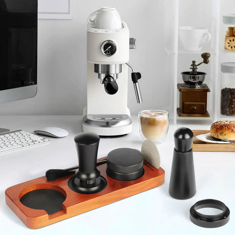 All In One 7 Piece Espresso Accessories Kit For Home Baristas Includes 54mm Espresso Tamper WDT Needle Stirrer Wood Tamping Station Dosing Funnel Brush Puck Screen And Distributor For Perfect Clean Shots Every Time displayed on countertop