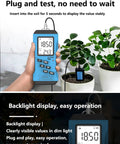 Person holding 7 In 1 Soil Tester Digital PH Meter for soil measurement with backlit LCD near potted plants indoors.