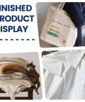 Display of a tote bag with text, folded textured blankets in neutral tones, and a close-up of a white shirt collar.