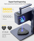 Dope 60W Galvo Laser Engraver Cutter, Handheld Portable Engraving Machine on slate heart, showcasing fine detail capability.