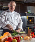 Chef using Diamond Knife Sharpener Set With Grits 400 And 1200 Built In Angle Guides Monocrystalline Diamond Stones in kitchen