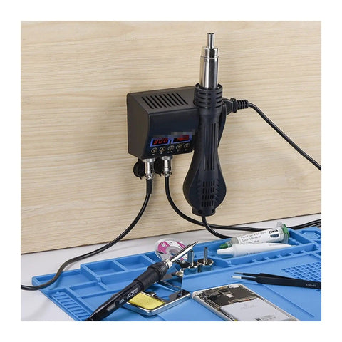 Pro Grade 2 in 1 Soldering Station With Hot Air Rework 800W, Dual LCD Displays on a workbench with tools and phone repair items