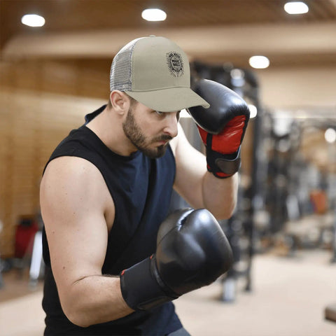 Man boxing wearing Lightweight Low Profile Trucker Hat For Men Apricot Washed Cotton Dad Cap With Adjustable Strap