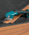 Badass Compact 12V Max Lithium Ion Cordless Multi Cutter Slick Flexible Material Trimmer With Lock Off Switch Total Game Changer For Weekend Warriors Diy Hustlers Blue Finish cutting through cardboard.