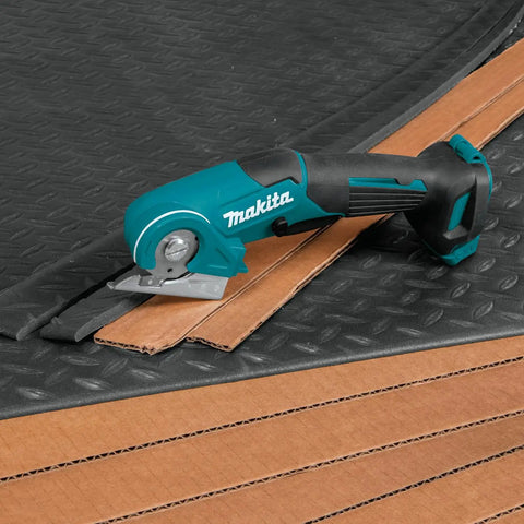 Badass Compact 12V Max Lithium Ion Cordless Multi Cutter Slick Flexible Material Trimmer With Lock Off Switch Total Game Changer For Weekend Warriors Diy Hustlers Blue Finish cutting through cardboard.