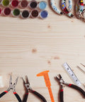 19 Piece Jewelry Making Tools Kit With Zipper Storage Case For Crafting And Repair Perfect DIY Beading And Wirework Set For Beginners And Pros At Home displayed on a wooden table with pliers, needles, and beads.
