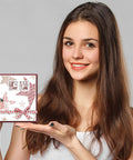 Young woman showcasing a handmade card using Vintage Date Clear Stamps Top Shelf Seal Set for scrapbooking.
