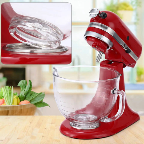 KitchenAid tilt-head stand mixer with glass bowl, detailed view of attachment mechanism in a kitchen setting.