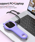 Portable Kids Microscope With 2 Inch Screen And 1080P Autofocus connected to a laptop for STEM outdoor science use, purple.