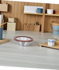 Heavy Duty Diamond Cup Grinding Wheel 100mm Silver Concave Abrasive Disc for Tough Metal Polishing on a workshop table.