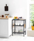 Real Deal Three Tier Rolling Cart With Smooth Ride Wheels For Kitchen Microwave Storage And Flexible Home Organization against a white wall.