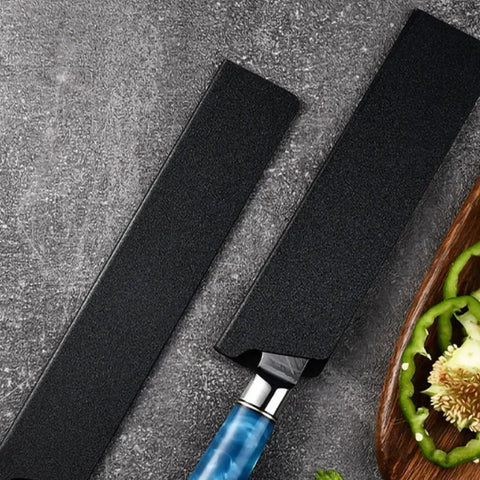 5 Piece Cutter Protective Covers Set With Flocking Lining on textured surface, one partially covering a blue-handled knife