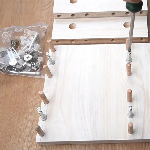 Top Shelf 3 In 1 Eccentric Wheel Nut Connectors For Furniture Assembly With Pre Inserted Nut And Dowel Pins on wooden panels.