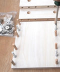 Heavy Duty Eccentric Cam Lock Nuts 20 Pack Hidden Furniture Screws With Dowel Pins And Pre Inserted Nut being installed in wood panels.