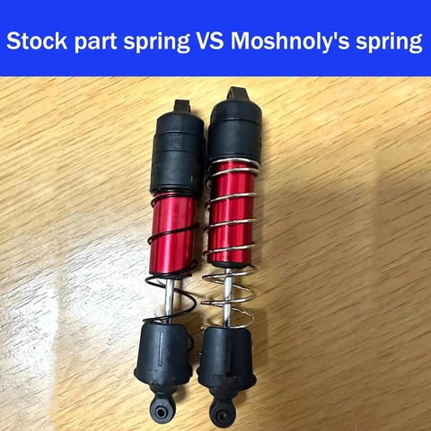 Comparison of ARRMA 1/8 Mojave 4S Spring Steel Shock Absorber Springs 1.8mm Wire vs stock part on wooden surface.