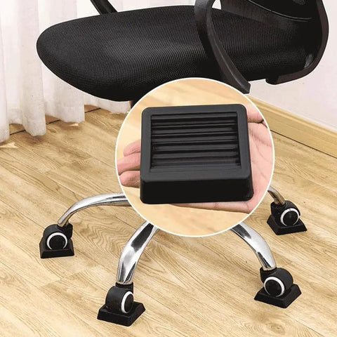 5 Pc Non Slip Furniture Pads Wheel Stoppers For Office Chairs And Couches Lock Down Heavy Furniture With Durable Rubber Grips close-up on a black rubber pad under a chair wheel.