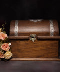 Two Piece Bronze Zinc Alloy Swing Arm Hasp Latch Set With Heavy Duty Mounting Screws For Jewelry Boxes Cabinets And Toolboxes on a wooden chest with floral decor.
