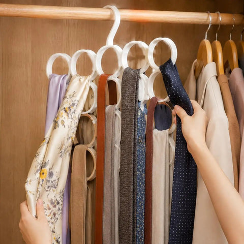 Slick Closet Organizer And Scarf Hanger That Crushes Your Morning Clutter With Wide Loops For Quick Belt Tie And Hijab Storage A Total No Sweat Daily Essential And Big Time Gift, holding multiple scarves.