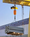Powerful Heavy Duty Electric Chain Hoist 2200 Lbs Lift With 10 Ft Range And 1300W Motor lifting steel rods from a pallet.