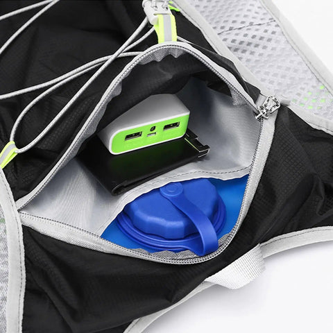 Interior of All Day Hydration Vest With Water Reservoir For Trail Ready Rides On The Go And Runs showing pocket with power bank.