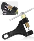 Motorcycle chain breaker tool, black metal with threaded screw press for removing chain links.