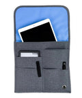 The Low Key Essential Airplane Seat Back Organizer Expands Over Tray Tables, gray fabric with tablet pockets for seamless flight organization.