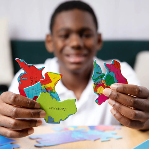 Child assembling World Map Geography Puzzle For Kids 68 Piece Educational Puzzle Game Learn Countries Capitals States And Provinces