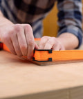 Heavy-Duty Adjustable Band Clamp For Woodworking And Framing, 15-Foot Strap, used on square wood piece with self-locking ratchet