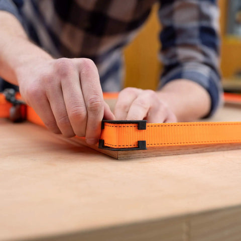 Heavy-Duty Adjustable Band Clamp For Woodworking And Framing, 15-Foot Strap, used on square wood piece with self-locking ratchet