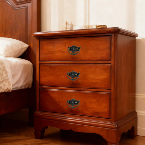 Wooden bedside cabinet with vintage antique cabinet bail pull handles set of 8 in bronze finish, drop ring pulls installed on drawers.