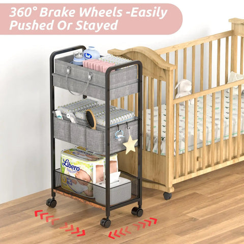 Three Tier Rolling Baby Diaper Caddy And Organizer Cart On Wheels with dividers beside nursery crib, large capacity, white.