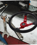Dope 14 Inch PU Drifting Steering Wheel With Horn Button Universal Fit For Car Golf Cart And Racing Simulators Crimson Racing Game Steering Wheel For Outdoor Use displayed on a workbench