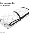 Big 48x28 Inch Ironing Mat Pad With 3mm Padding And Silicone Iron Rest folded with white tiles pattern for storage.