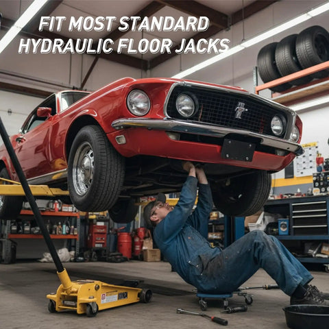 Mechanic using hydraulic floor jack lifting car in garage workshop tool room race trailer