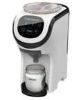 Baby Brezza Formula Pro Mini white compact baby formula mixer dispensing into a bottle