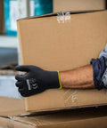 Ultra Thin PU Coated Work Gloves 60 Pairs With Excellent Grip Nylon Shell Black Polyurethane Coating Knit Wrist Cuff Bare Hand Feel For Light Duty Work worn while carrying a cardboard box
