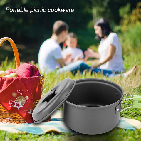 8 Piece Portable Camping Cookware Set for Outdoor On The Go Cooking with aluminum pot and lid on picnic blanket