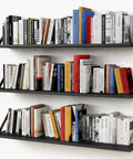 Legit Heavy Duty Floating Wall Shelves Set of Three, Slick 36 Inch by 8 Inch Black Bookshelf for Bedroom Living Room Office, showcasing books.