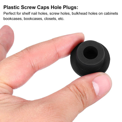 Close-up of a Three Pack T Shaped Silicone Plugs 20mm Diameter Snap In Hole Seal Covers Black Round Rubber Stopper held between fingers